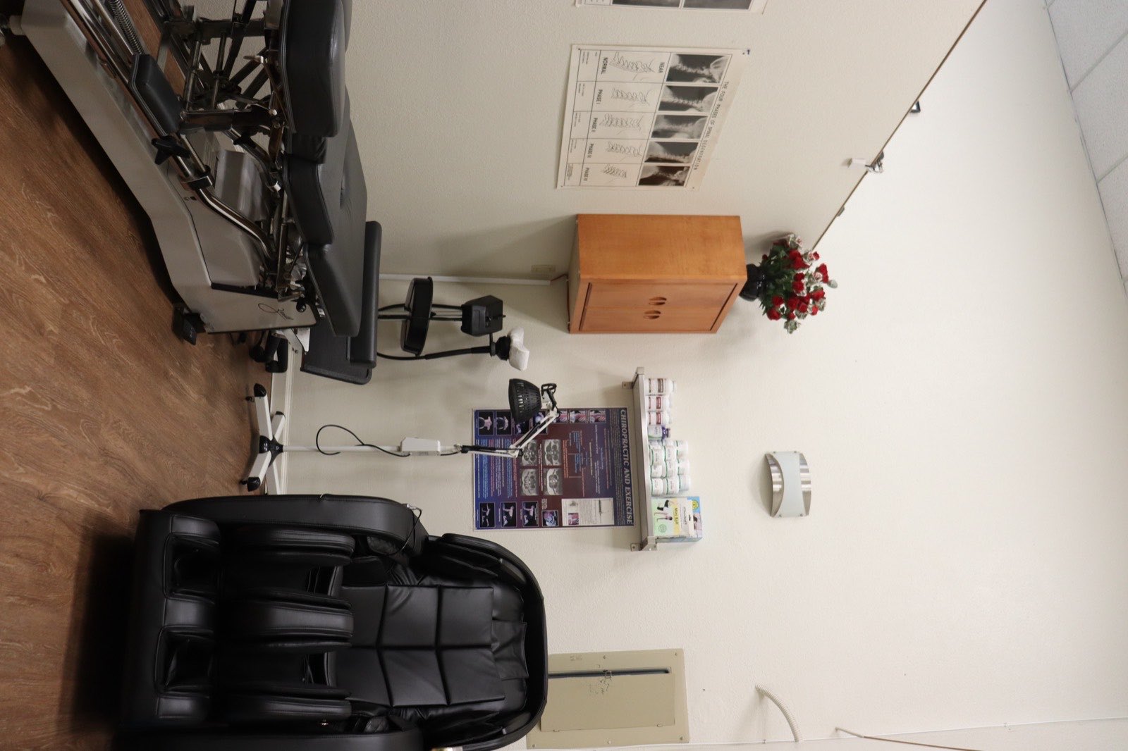 Treatment room with adjusting table and massage chair